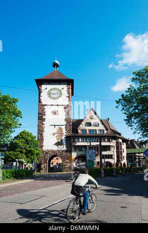 cyclist at the old town city gate, Freiburg, Baden-Wurttemberg, Germany, Europe Stock Photo