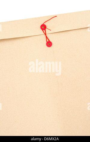 Manila office envelope with red string and space for text. Stock Photo