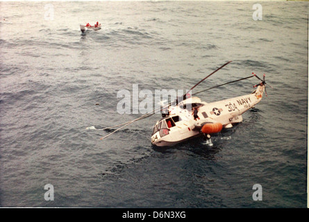 Navy HS-2 being repaired by USS Hornet after open sea landing Stock Photo