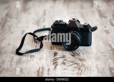 old camera on a wooden dance floor Stock Photo