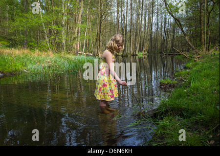 Birch Werder, Germany, a girl on the nature trail in Briesethal looking for frogs Stock Photo