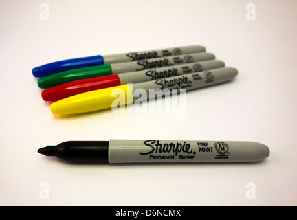 Sharpie permanent markers on a white background. Black marker in focus. Stock Photo