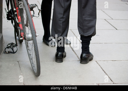 man with trousers tucked into socks as improvised cycle clips oxford d6nh4b
