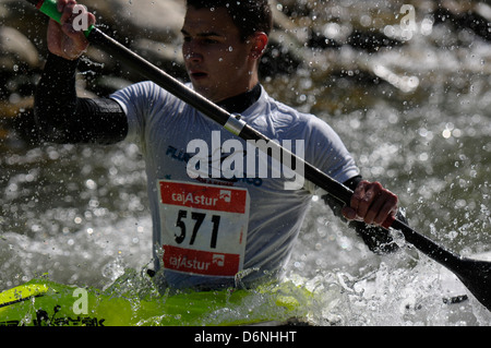 Kayakers and canoeists competing in Piloña River, Asturias, Spain. Stock Photo