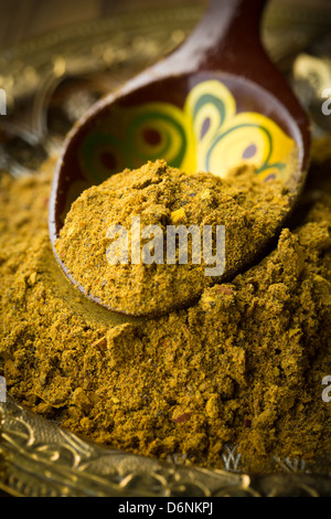 Curry powder on moroccan spoon Stock Photo
