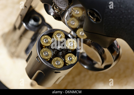 revolver handgun with fired 9mm cartridges in cylinder Stock Photo