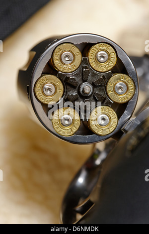 revolver handgun with fired 9mm cartridges in cylinder Stock Photo