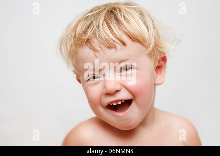 closeup portrait of a baby girl laughing w/ copy-space Stock Photo