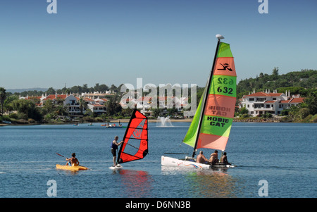 People enjoying watersports on the lake at Quinta do Lago in the Algarve region of Portugal. Stock Photo