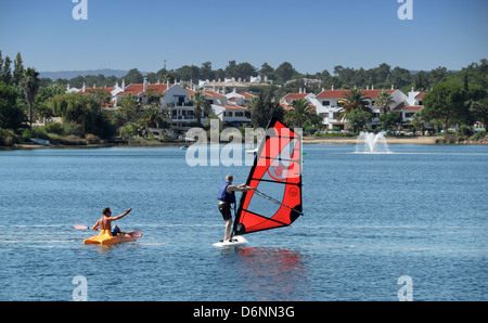 People enjoying watersports on the lake at Quinta do Lago in the Algarve region of Portugal. Stock Photo