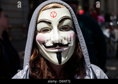 Woman wearing Guy Fawkes mask Stock Photo