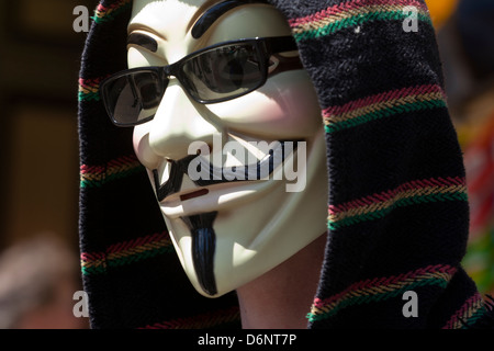 Man wearing Guy Fawkes mask Stock Photo