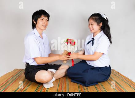 Boyfriend gives flower to girlfriend Stock Photo