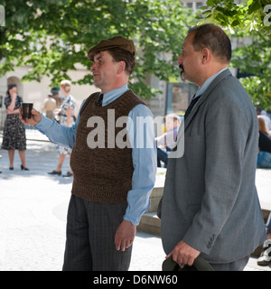 Film extras waiting on location, Prague Stock Photo