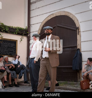 Film extras waiting on location, Prague Stock Photo