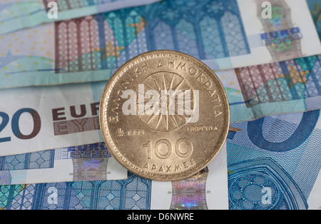Berlin, Germany, Euro notes and former Greek Drachma coin Stock Photo