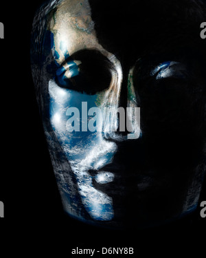 translucent reflective human head made of glass with global surface on it in black back Stock Photo