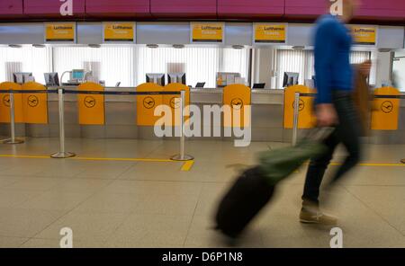 Check-in desks of the airline Lufthansa are empty during a warning strike of employees of Lufthansa at Tegel airport in Berlin, Germany, 22 April 2013. Employees of Lufthansa strike to improve an ongoing collective bargaining and negotiations on labor conditions. Photo: Tim Brakemeier/dpa Stock Photo