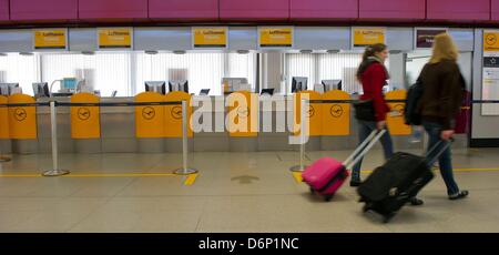 Check-in desks of the airline Lufthansa are empty during a warning strike of employees of Lufthansa at Tegel airport in Berlin, Germany, 22 April 2013. Employees of Lufthansa strike to improve an ongoing collective bargaining and negotiations on labor conditions. Photo: Tim Brakemeier/dpa Stock Photo