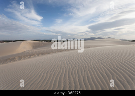 Ripples of sand leading off to the distant mountains. Stock Photo