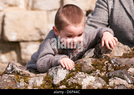 Toddler Climbing A Wall Stock Photo