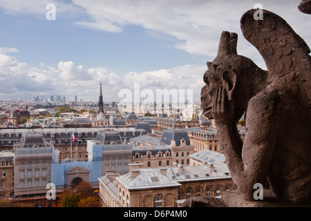 A gargoyle stares out from Notre Dame de Paris cathedral, Paris, France, Europe Stock Photo