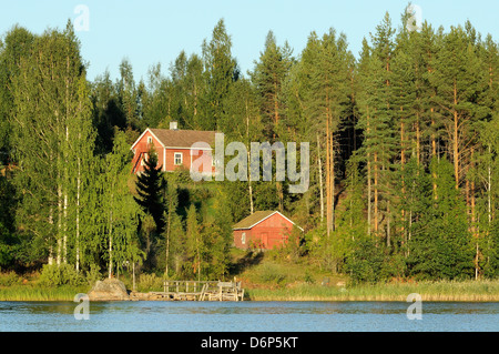 Finnish summer house on a wooded island in Lake Saimaa by sunset light, near Savonlinna, Finland, Scandinavia, Europe Stock Photo