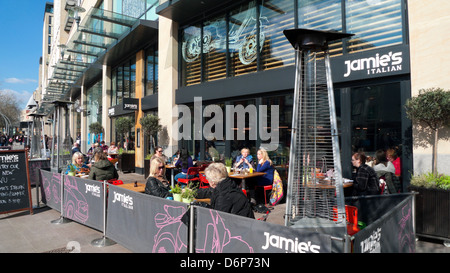 People sitting at tables dining outside Jamie's Italian Restaurant Cardiff City Centre, Wales UK  KATHY DEWITT Stock Photo