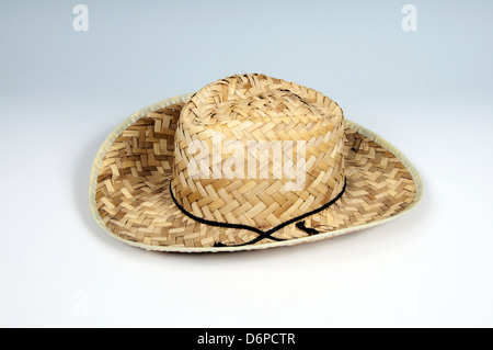 Gents straw sun hat against a plain background. Stock Photo