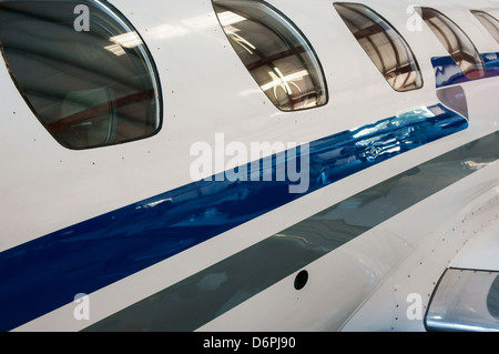 Cessna Citation II private jet in hangar. Stock Photo