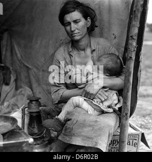 This iconic photograph by Dorothea Lange, titled 'Migrant Mother,' captures Florence Owens Thompson during the Great Depression in Nipomo, California, symbolizing the hardships faced by migrant workers during the 1930s. Stock Photo