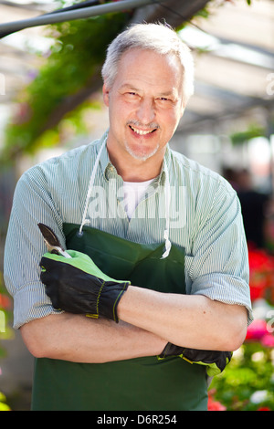 Portrait of a smiling greenhouse worker Stock Photo
