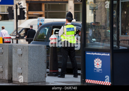 London, UK, Bobby the Metropolitan Police controlled traffic in the City Stock Photo