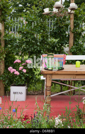 Country Kitchen dresser with home grown produce and flowers Stock Photo