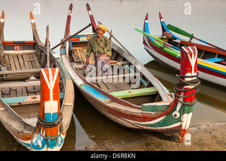 Fisherman sitting in his boat on Taungthaman Lake, Amarapura, Mandalay, Myanmar, (Burma) Stock Photo