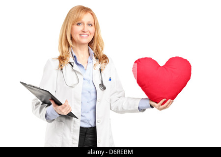 A female doctor holding a red heart isolated on white background Stock Photo