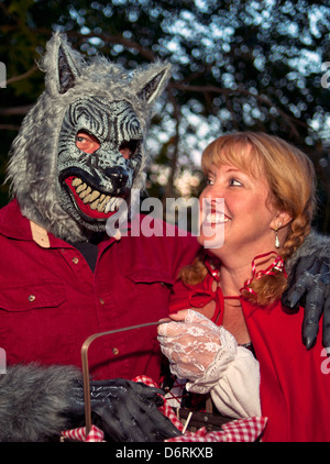 A couple in costumes as 'Red Riding Hood' and 'The Big Bad Wolf' Stock Photo