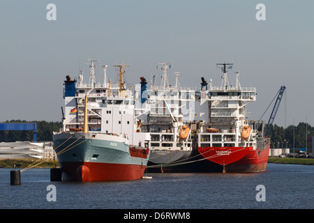 Emden, Germany, four container ships lie at anchor in the inner harbor of Emden Stock Photo