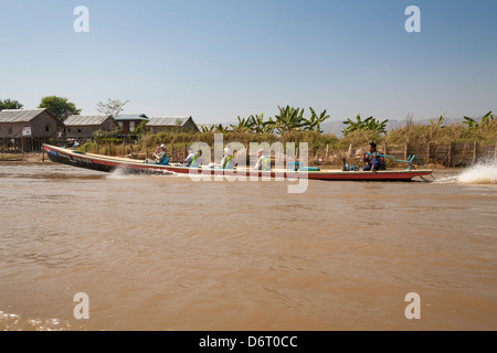 Tourists travelling in a boat, Inle Lake, Shan State, Myanmar, (Burma) Stock Photo