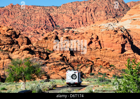 Motorhome surrounded by red rock formations in the campground at Snow Canyon State Park, near St. George, Utah Stock Photo