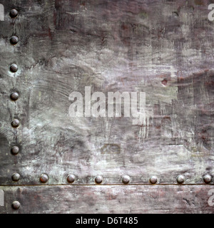 Black grunge metal plate or armour texture with rivets as background Stock Photo