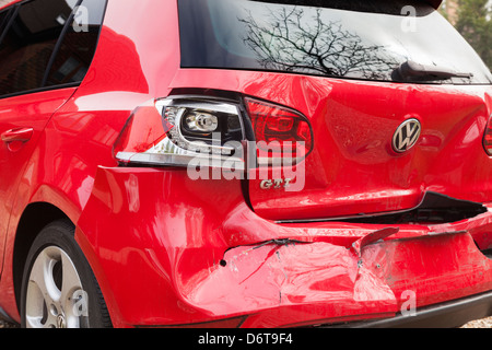 Crashed red Volkswagen Golf GTI car - damaged by rear impact Stock Photo