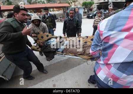 Darkoush, Syria. 21st April, 2013. A local is rushed into the Gift of the Givers hospital on April 21, 2013, in Darkoush, Syria. During the last week, there have been 5 shelling incidents in the Northern side of Syria. (Photo by Gallo Images / The Times / Esa Alexander) Stock Photo