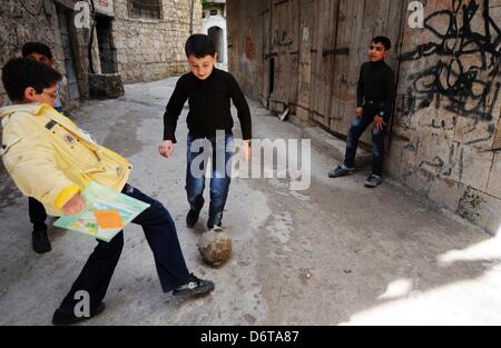 Darkoush, Syria. 21st April, 2013. Kids playing football in the streets on April 22, 2013, in Darkoush, Syria. During the last 8 days, 45 South African medical personnel have provided medical care to 4000 Syrians. Their mission draws to a close at the end of April 2013. (Photo by Gallo Images / Foto24 / Felix Dlangamandla) Stock Photo