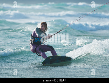 Woman enjoying kitesurfing. Tarifa, Costa de la Luz, Cadiz, Andalusia, Spain, Europe. Stock Photo