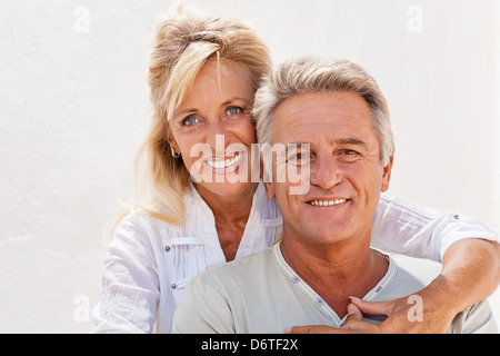 Mature couple smiling and embracing Stock Photo