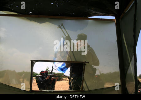 April 23, 2013 - Rafah, Gaza Strip, Palestinian Territory - Palestinian militants from the National Resistance Brigades the armed wing of the Democratic Front for the Liberation of Palestine, take position during a military exercise refresher in Rafah town in the souther west of Gaza strip on, April 23, 2013  (Credit Image: © Eyad Al Baba/APA Images/ZUMAPRESS.com) Stock Photo