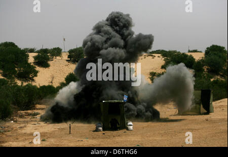 April 23, 2013 - Rafah, Gaza Strip, Palestinian Territory - Smoke is rises from an exercise site during military exercise refresher for the National Resistance Brigades the armed wing of the Democratic Front for the Liberation of Palestine in Rafah town in the souther west of Gaza strip on, April 23, 2013  (Credit Image: © Eyad Al Baba/APA Images/ZUMAPRESS.com) Stock Photo