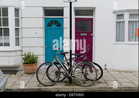 Bicycles chained to post, Brighton, UK Stock Photo