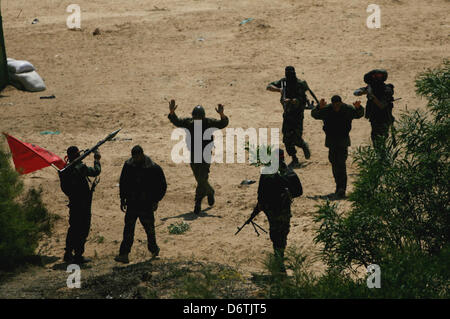 April 23, 2013 - Rafah, Gaza Strip, Palestinian Territory - Palestinian militants from the National Resistance Brigades the armed wing of the Democratic Front for the Liberation of Palestine, take position during a military exercise refresher in Rafah town in the souther west of Gaza strip on, April 23, 2013  (Credit Image: © Eyad Al Baba/APA Images/ZUMAPRESS.com) Stock Photo